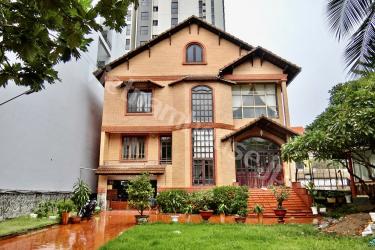 Villa with spacious lawn and vintage interior in Thao Dien