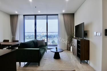 2-bedroom apartment highlighted by a cool green sofa
