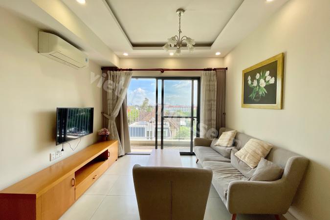 Minimalist Home with White and Wood Accents at Masteri Thao Dien